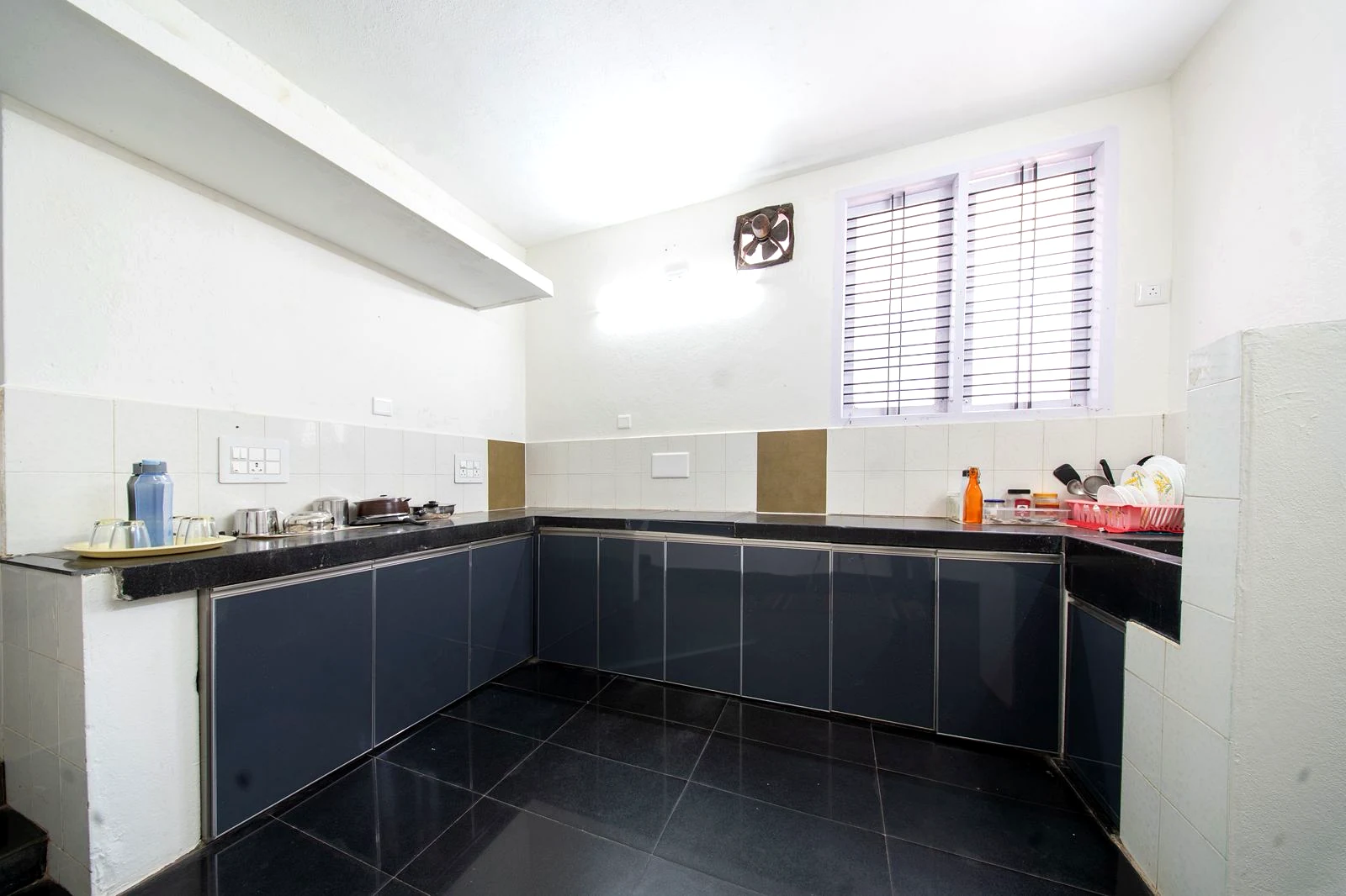 Ground floor kitchen with appliances at Mango Tree Homestay.